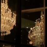 a chandelier hanging from the side of a building