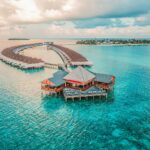 aerial photography of resort rooms and island as part of the ai concierge economy article